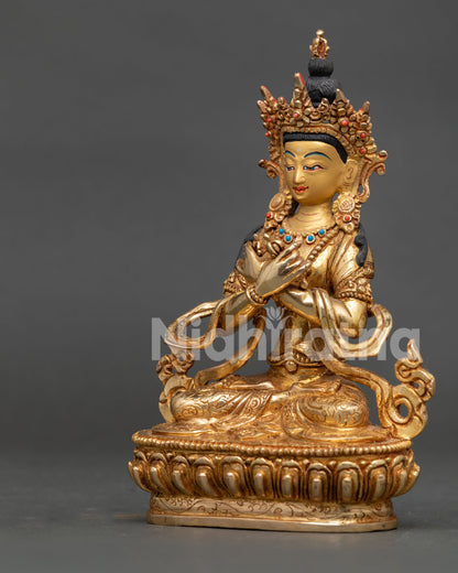 Handcrafted Vajradhara Statue in gold gilded copper with turquoise coral stones from Nepal.