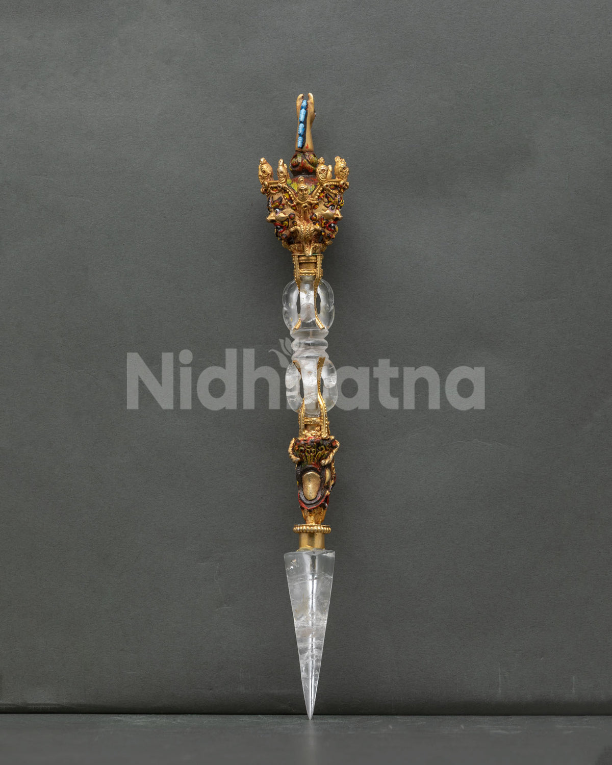 Handcrafted Vajrakilaya phurba from Nepal with crystal vajra shank and three wrathful faces, side view