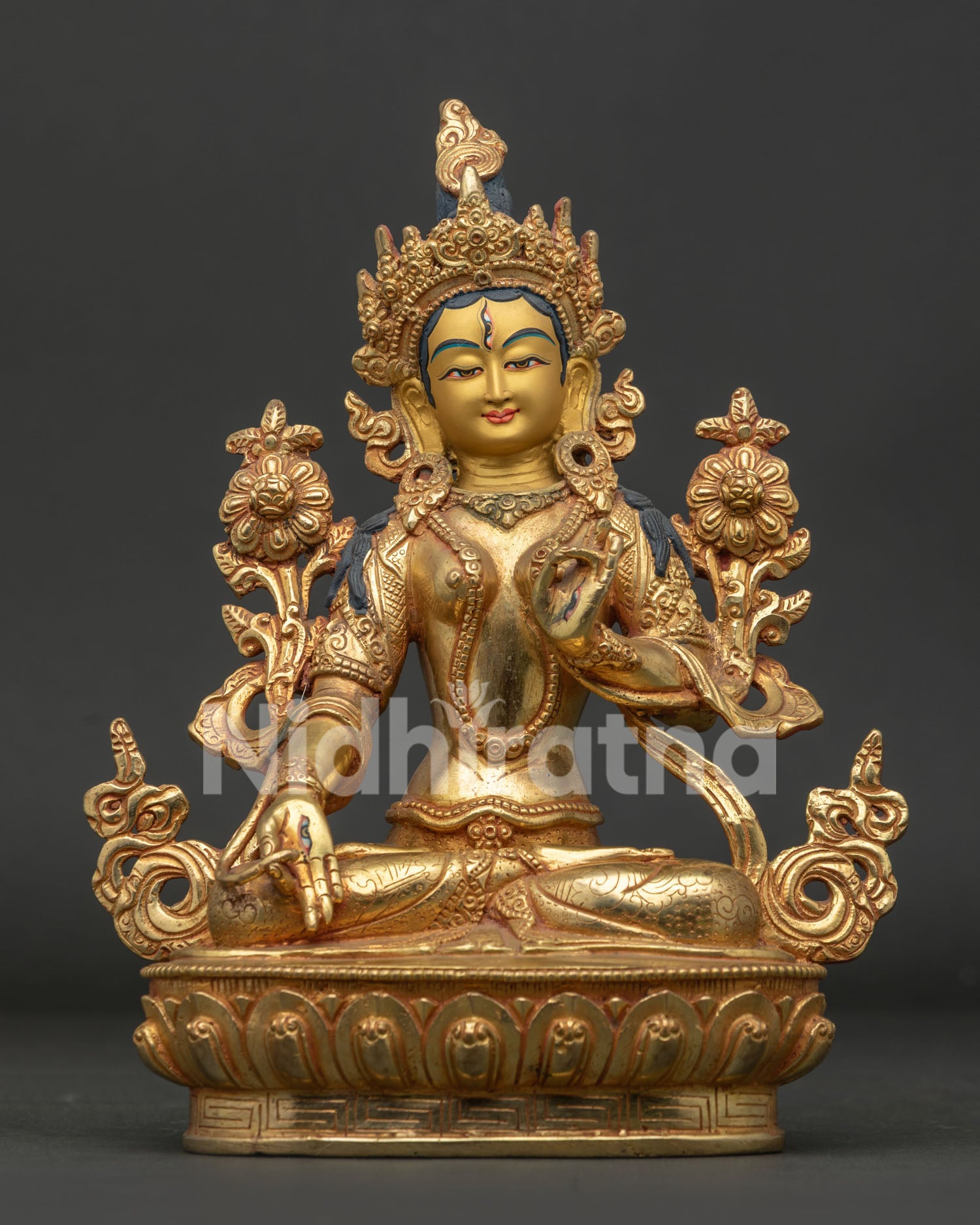 Handcrafted White Tara Buddhist sculpture seated on a lotus pedestal