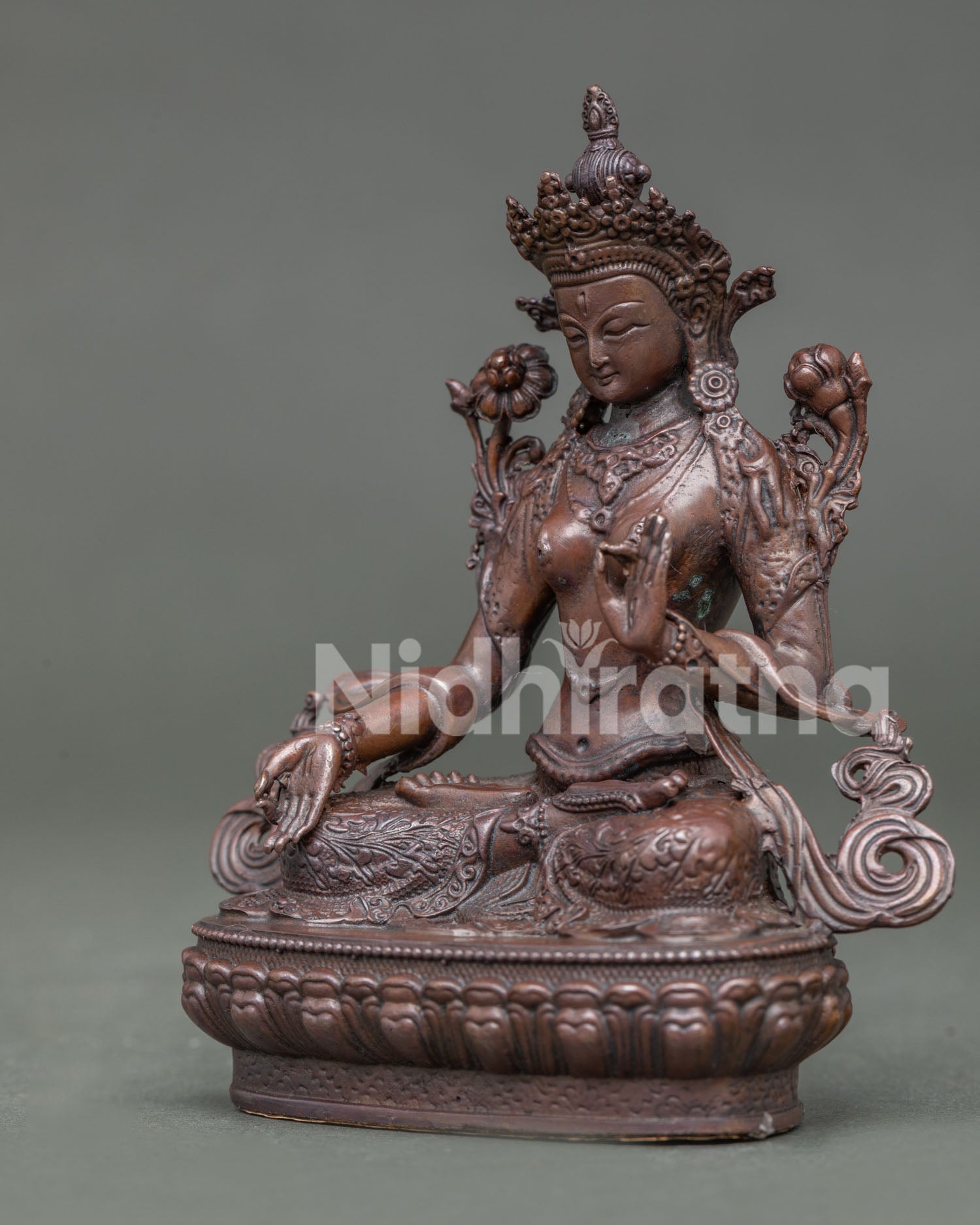 Handcrafted white tara statue with oxidized copper finish from patan nepal.