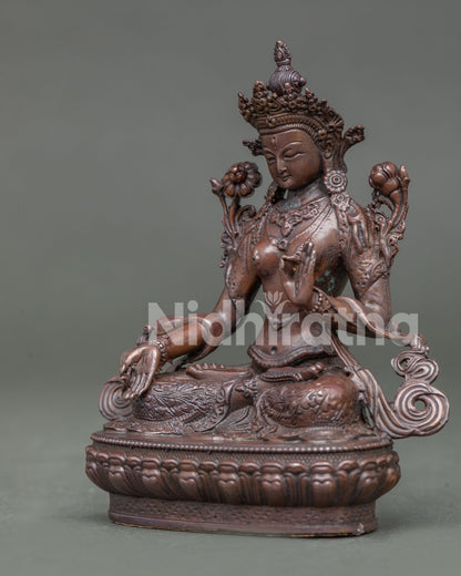 Handcrafted white tara statue with oxidized copper finish from patan nepal.