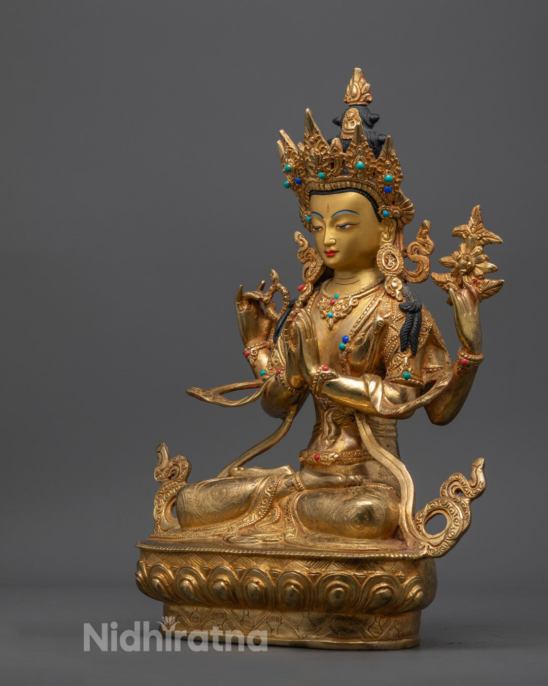 handcrafted Chenrezig Buddha statue painted with rich acrylic colors and traditional ornamentation