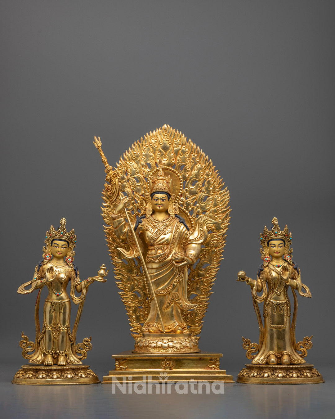 handcrafted Padmasambhava with Disciple Statue featuring 24k gold fire-gilded body, gold-gilded face, and intricate dhonka robe detailing – traditional Tibetan Buddhist art.