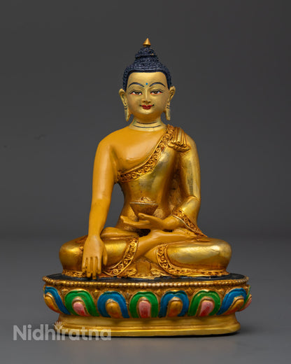 handcrafted Shakyamuni Buddha Statue with gold-gilded face and yellow body seated on lotus throne – symbol of enlightenment and inner peace.