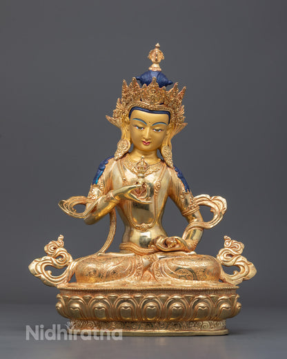 handcrafted Vajrasattva statue with gold-gilded face and fire-gilded body, seated on a lotus throne, symbolizing purification and spiritual renewal.