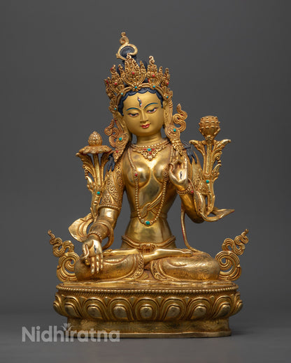 handcrafted White Tara Bodhisattva statue with gold-gilded face, seated on a lotus throne holding a blue utpala flower