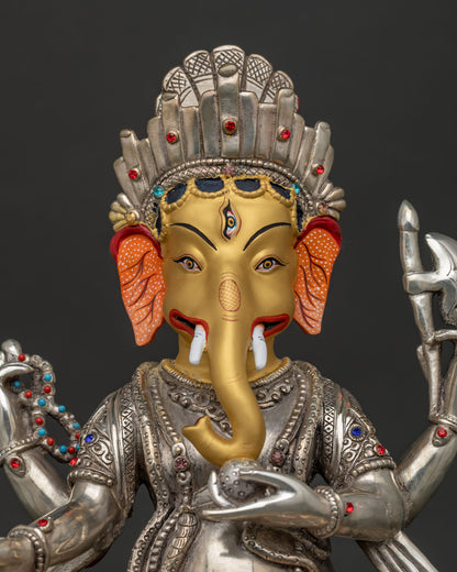 Handcrafted Ganesh idol close-up showing silver-plated copper with 24K gold face detail