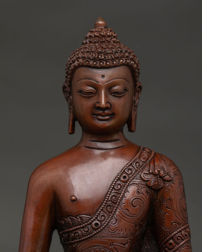 Handmade Amitabha Buddha statue from Nepal with floral motif robe close up.