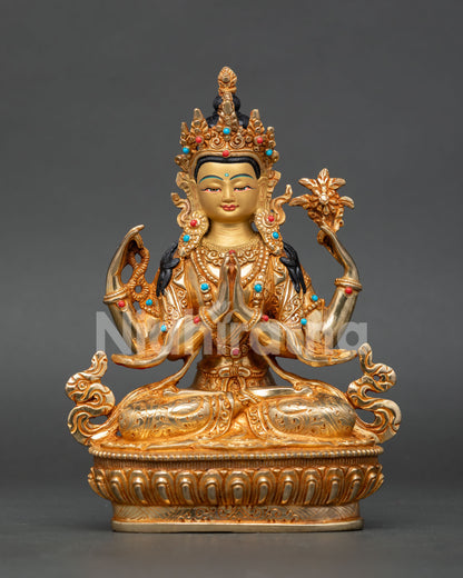 Handmade Chenrezig statue from Nepal with 24K gold gilding, four arms, and semi precious stone details
