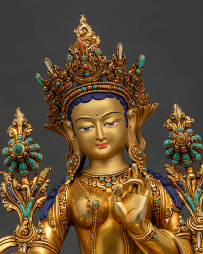 Handmade Green Tara Buddhist sculpture from Nepal with gold gilding, regular close-up view