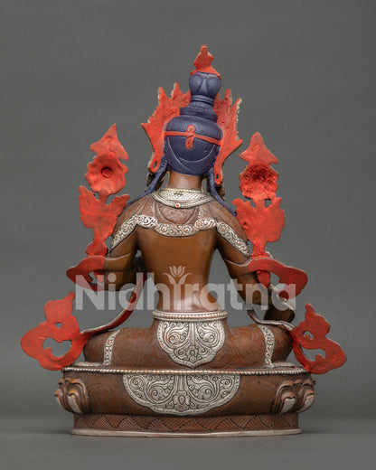 Handmade Green Tara statue from Nepal featuring lotus flower seat, extended leg posture, and sacred Buddhist meditation design.