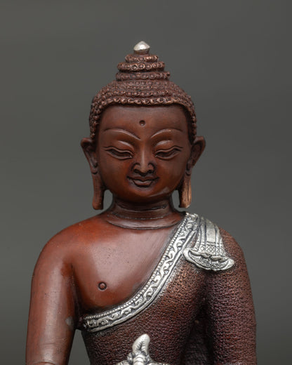 Handmade Medicine Buddha statue from Nepal with carved monk robe.