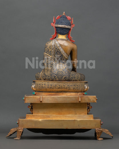 Handmade Nepalese Buddha statue with silver plated details and intricate traditional artistry