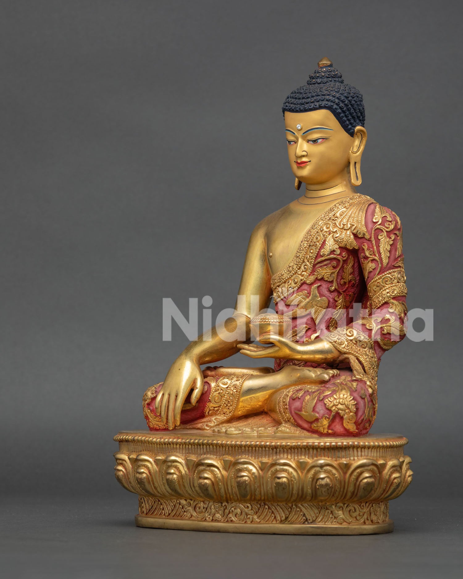 Handmade Shakyamuni Buddha sculpture with Earth Touching Mudra and engraved monastic robe with mythical buddhist motifs