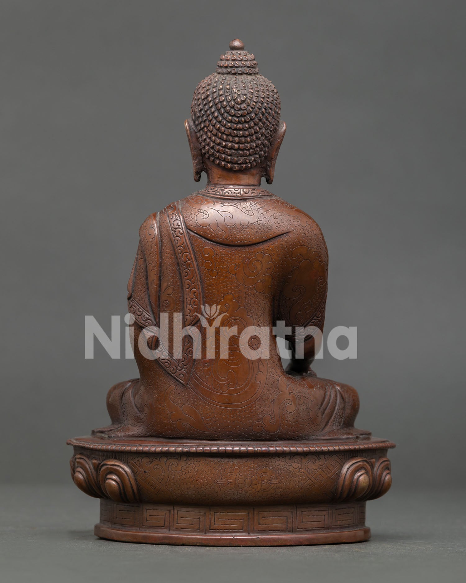 Handmade Shakyamuni Buddha statue from Nepal featuring lotus seat, sacred mudra, and peaceful home altar meditation decor.