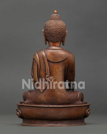 Handmade Shakyamuni Buddha statue with oxidized copper texture, traditional Nepalese artistry, and sacred Buddhist design.