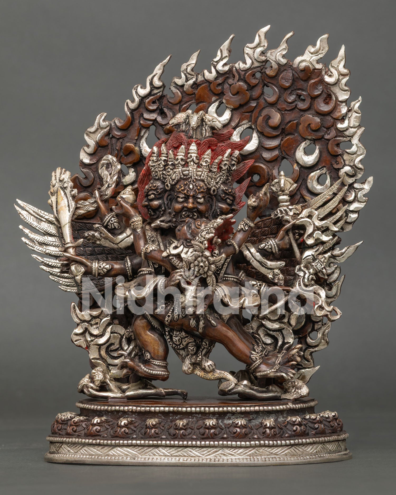 Hayagriva copper statue front view, three wrathful faces, flaming halo, Newari oxidized finish