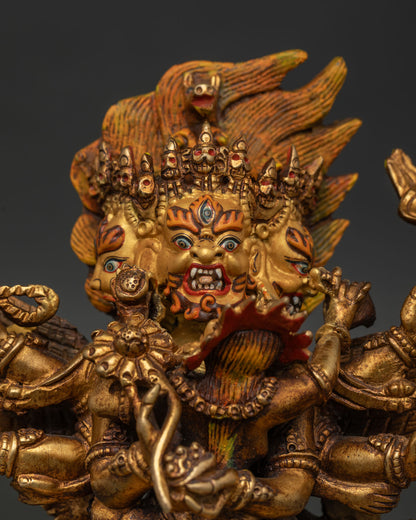 Hayagriva Statue Close Up with Three Fierce Faces Gold Painted Face and Ornate Jewelry.