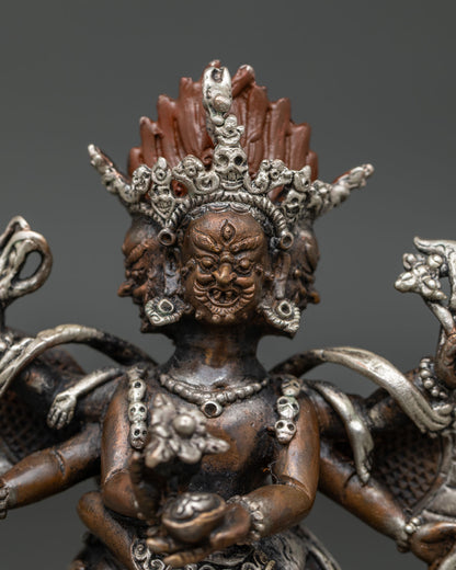 Hayagriva statue holding kapala kartika knife and sacred ritual implements.