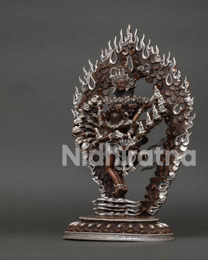 Hevajra Buddhist statue standing with consort Nairatmya on lotus pedestal detailed view.