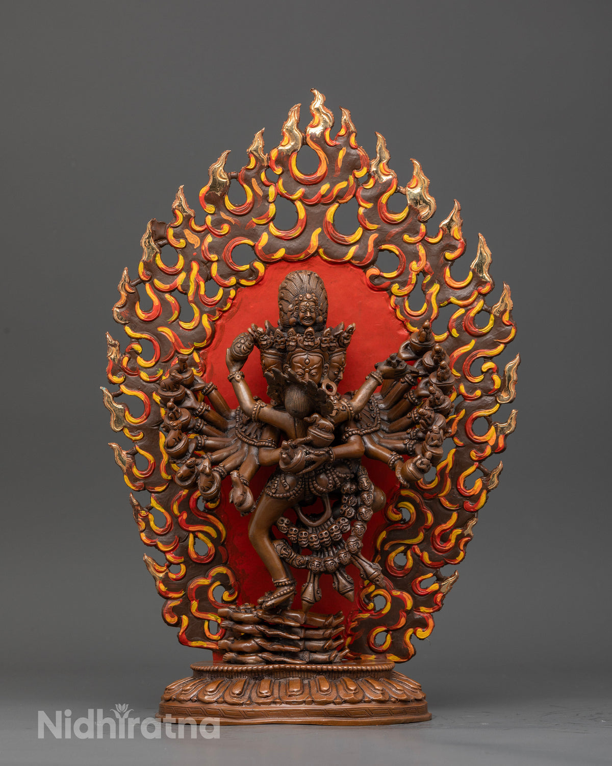 Hevajra statue with chemically oxidized copper finish and wrathful expression.