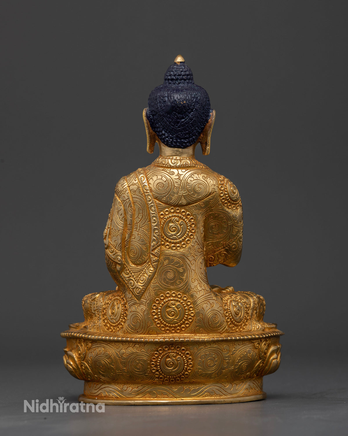 Himalayan Amoghasiddhi Buddha Statue symbolizing fearlessness and enlightened action.