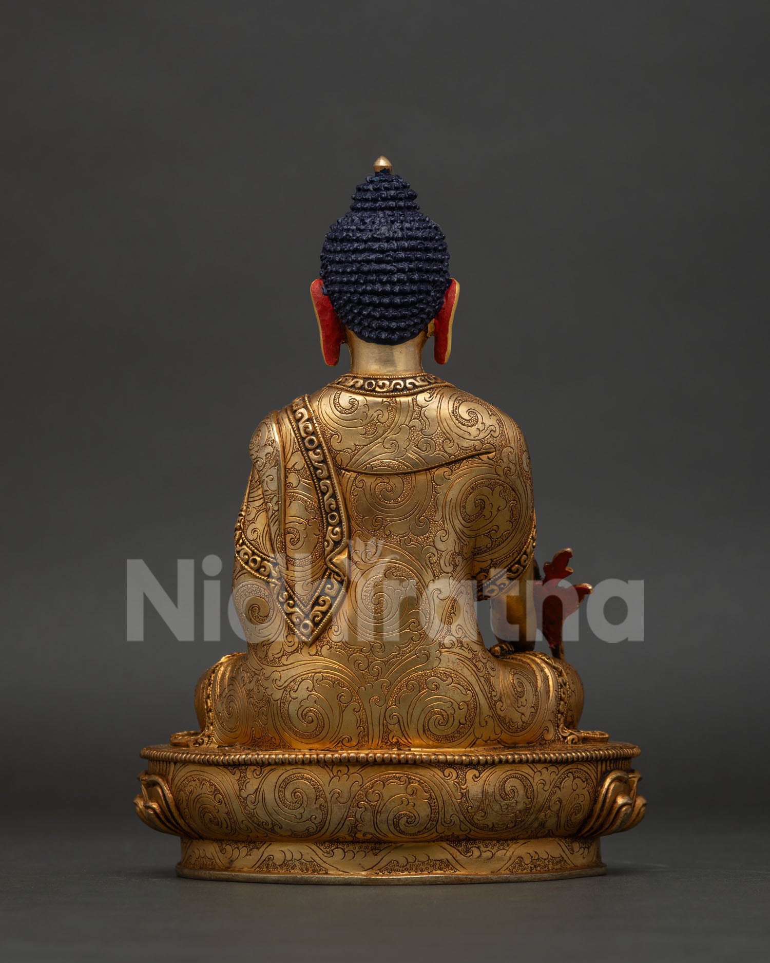 Himalayan Medicine Buddha statue handcrafted by Newari artisans with ornate robe detailing.