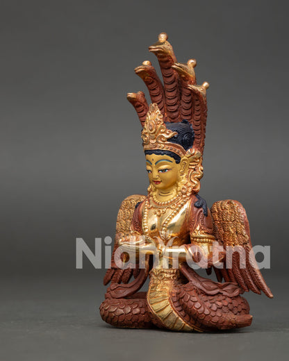 Himalayan Naga Kanya statue with wings and fire-gilded copper details.