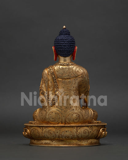 Himalayan Shakyamuni Buddha statue with hand carved floral motifs and ornate robe.