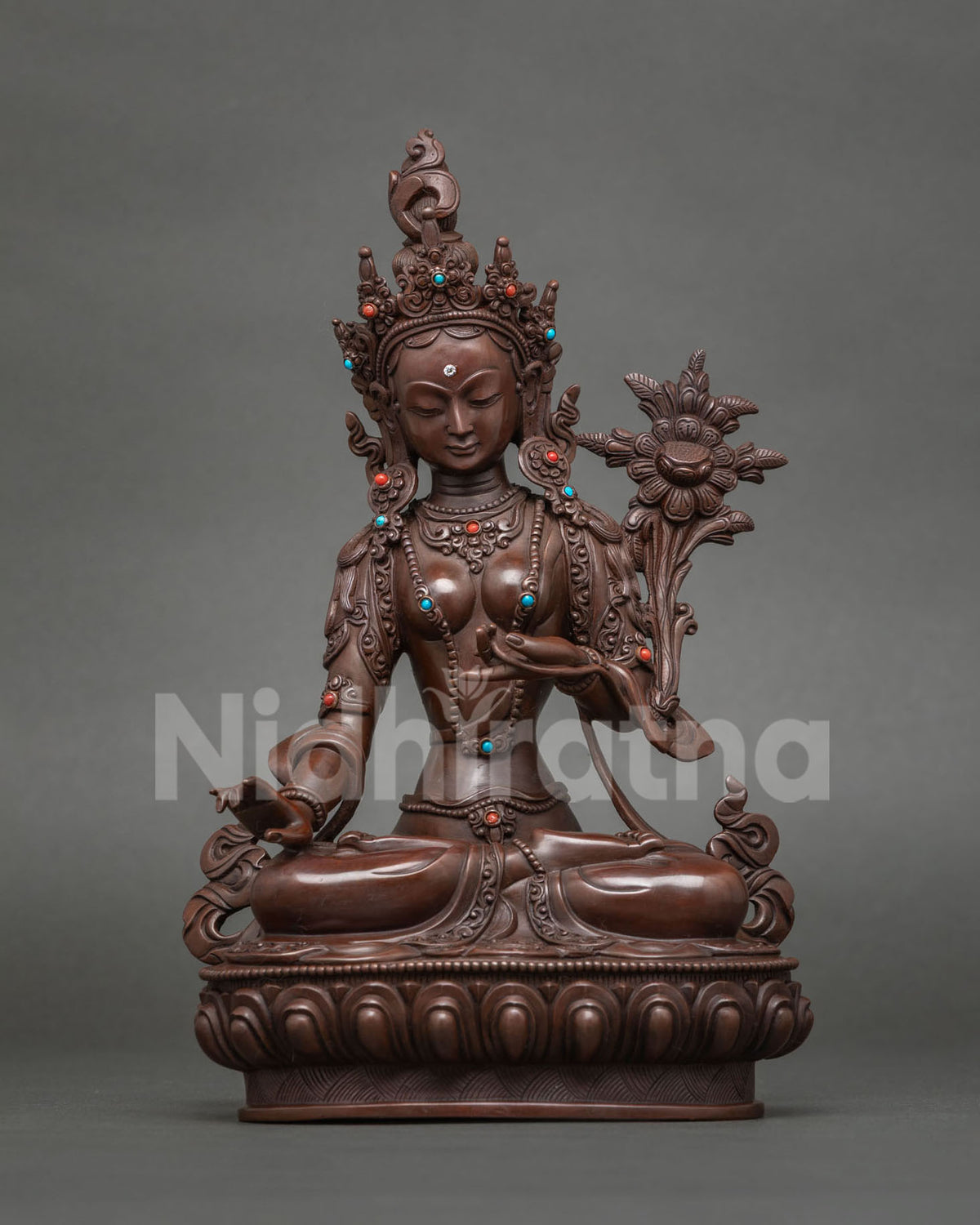 Humkaranadini Tara statue holding an utpala flower, oxidized copper, Surya Gupta tradition