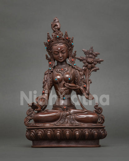 Humkaranadini Tara statue holding an utpala flower, oxidized copper, Surya Gupta tradition