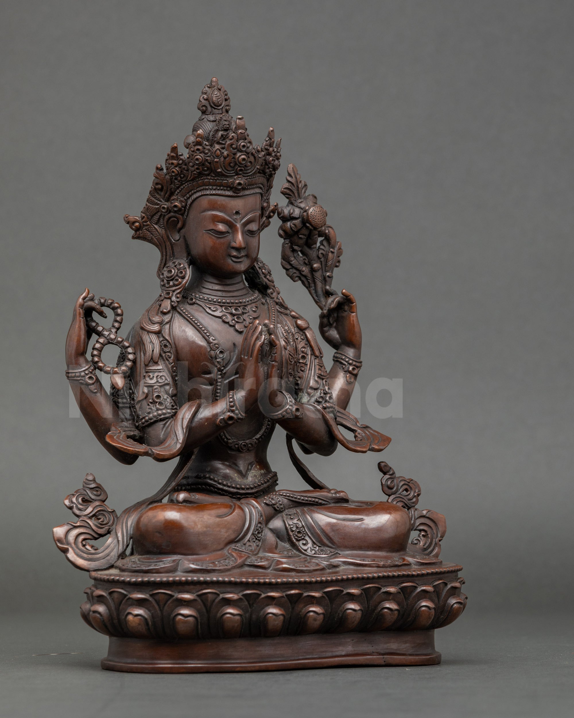 Side view of Avalokiteshvara seated on lotus, detailed Nepalese lost wax statue