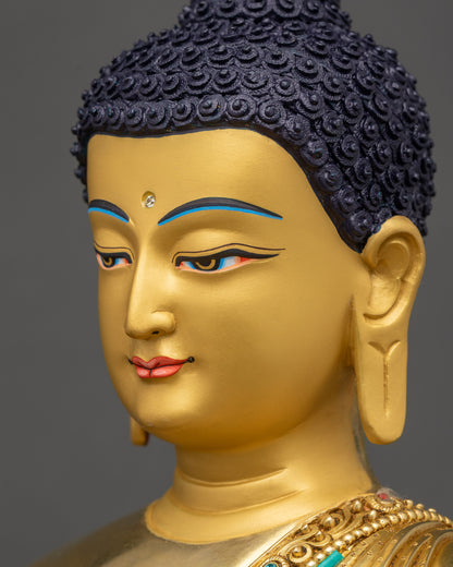 Side profile of Shakyamuni Buddha face with 24K gold and peaceful expression