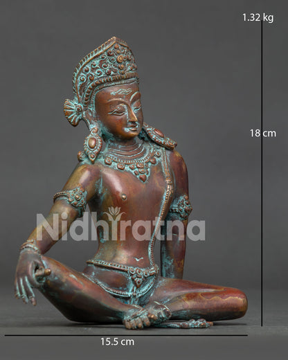 Indra statue showing traditional crown detailed jewelry and flowing dhoti.