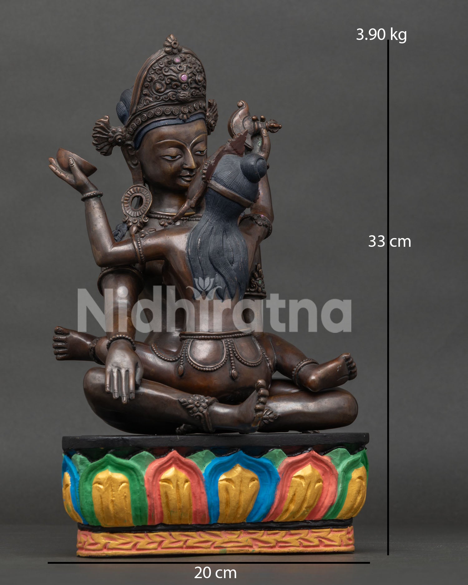 Indra with consort Buddhist statue in Yab-Yum posture on lotus pedestal.