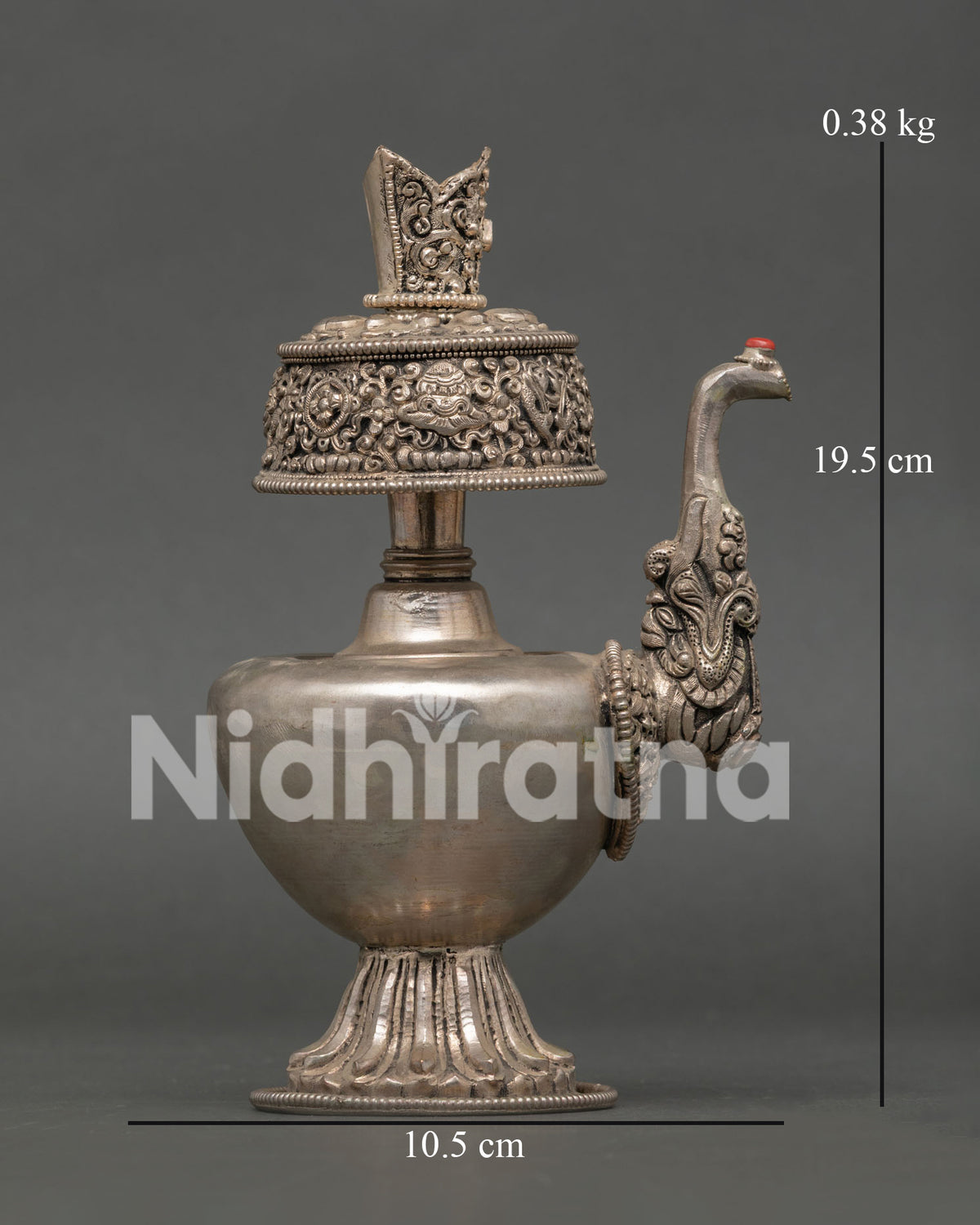 Intricate Buddhist symbols engraved on handcrafted Nepalese Bumba ritual vessel