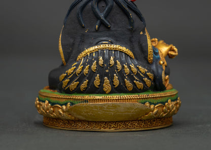 Intricate hand-carved gold floral pattern on the lower robes of a Nepalese Padmasambhava statue.