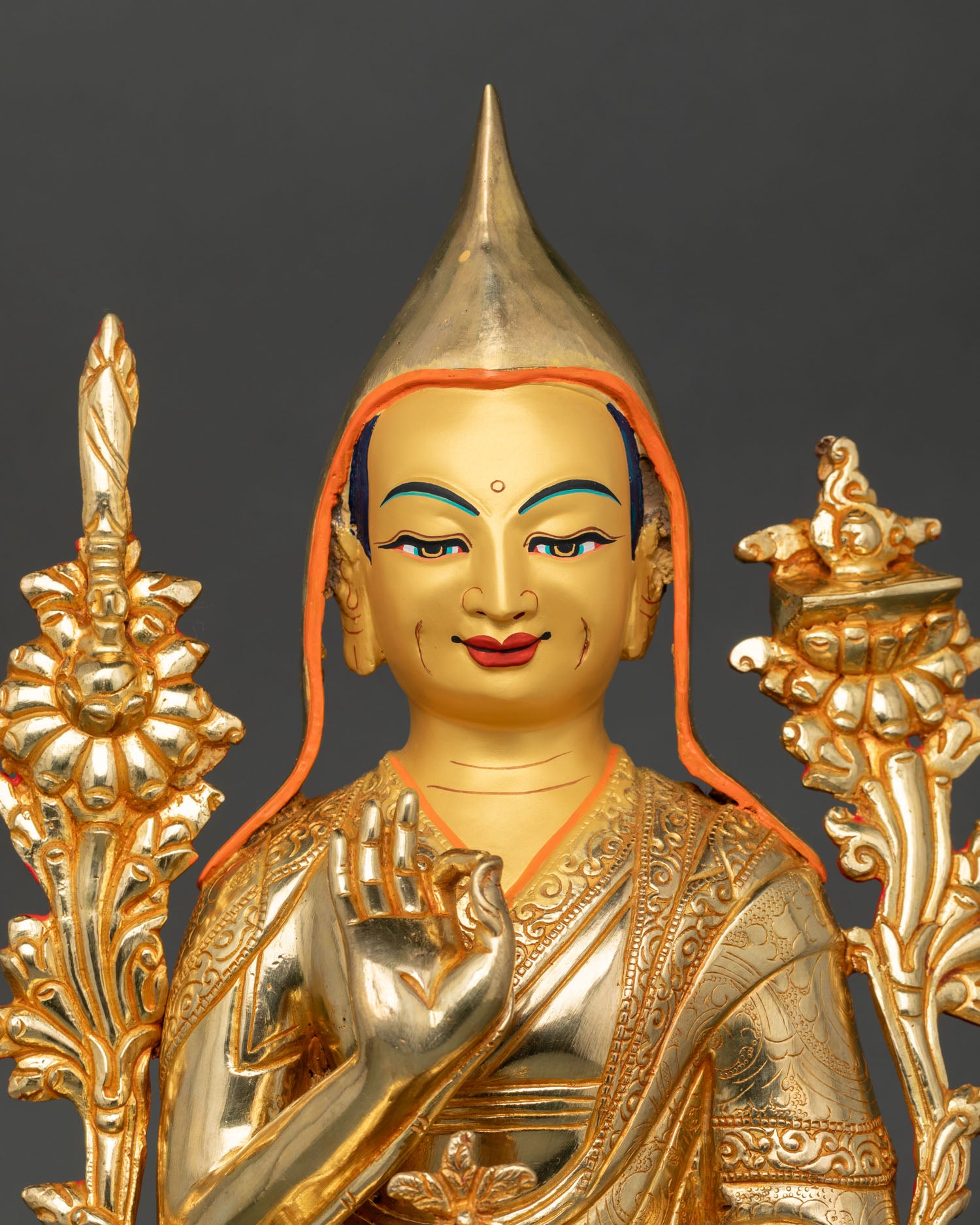 close up of je tsongkhapa face showing serene expression and detailed 24k gold fire gilded craftsmanship