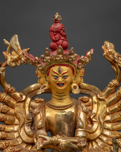 Kalachakra Buddhist statue with three wrathful faces and sacred ritual implements