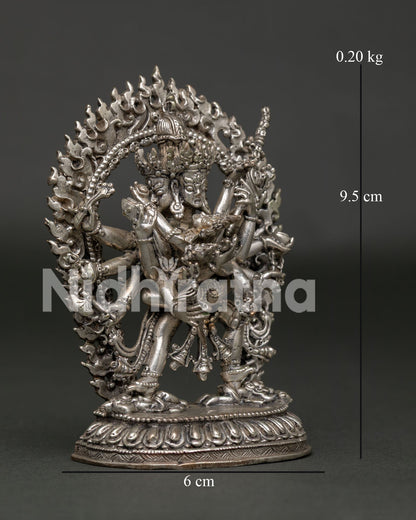 Kalachakra with consort Vishvamata standing on subduing figure atop lotus throne.