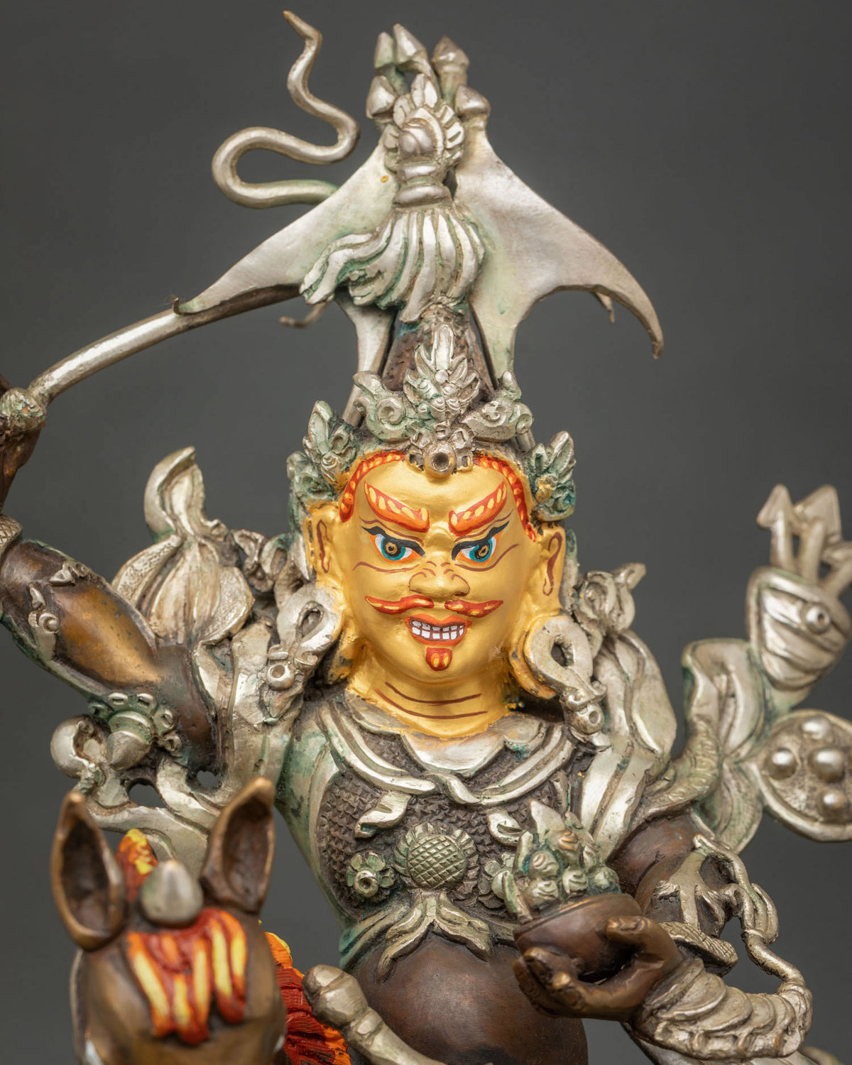 King Gesar statue with 24K gold painted face and silver plated finish.