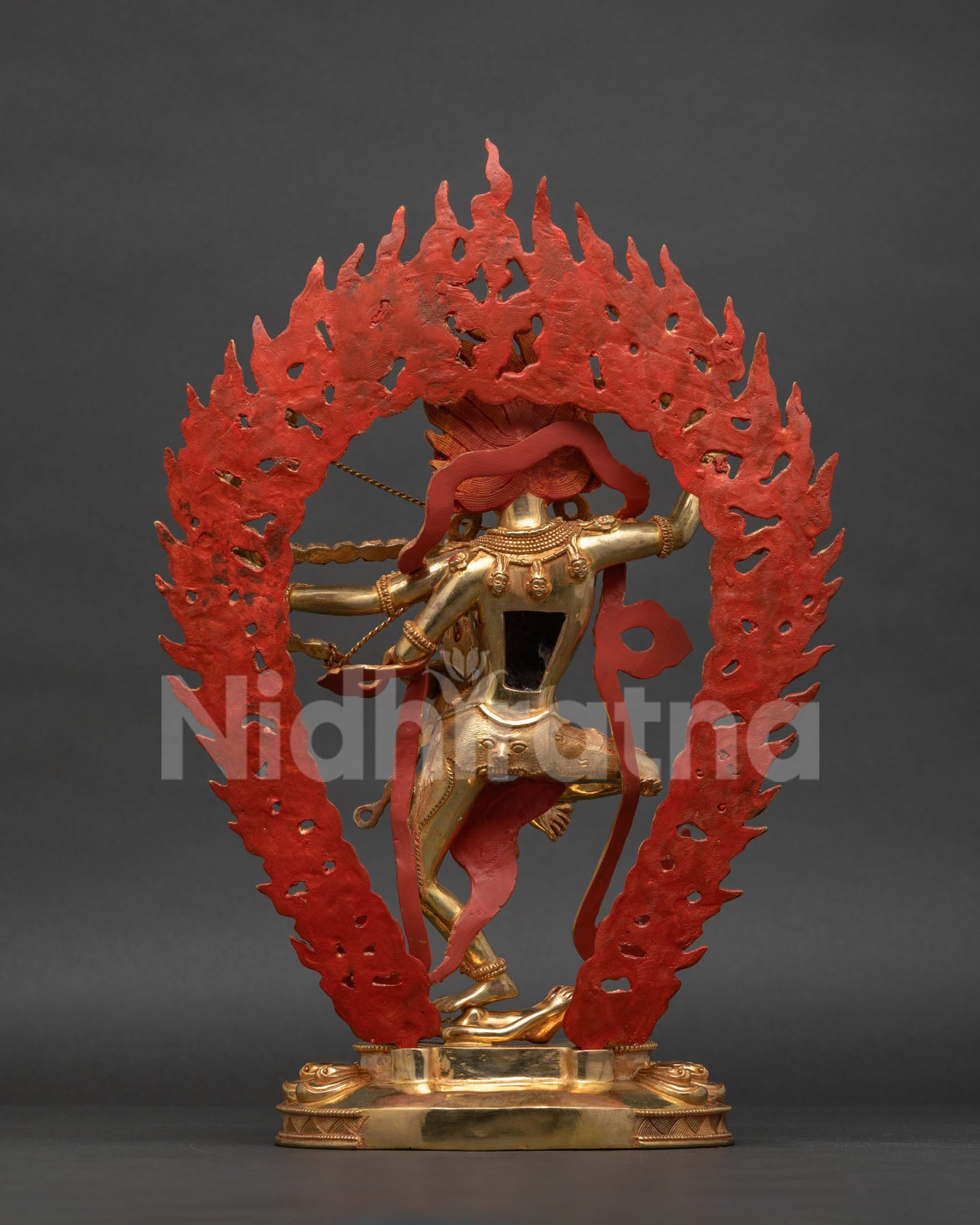 Kurukulla statue carved lotus pedestal Vajrayana Buddhist deity art.