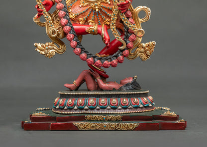 Kurukulla statue standing on lotus base subduing a human figure, gold-gilded copper Buddhist sculpture