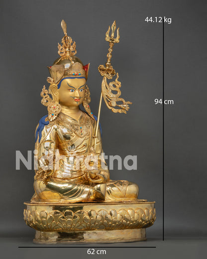 Large Guru Rinpoche statue side view showing ornate crown, vajra, khatvanga staff and Nepali Buddhist art