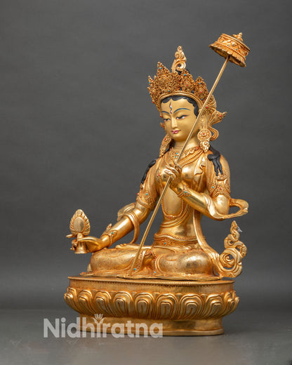 Left profile of Dukar statue, traditional lost-wax Nepalese craftsmanship with spiritual details