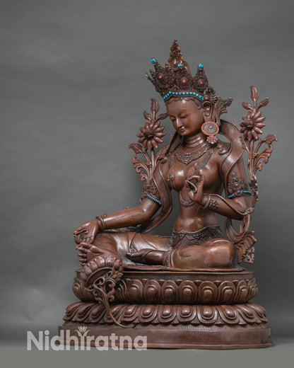 Left profile of Green Tara statue, grand copper sculpture with intricate Newari craftsmanship
