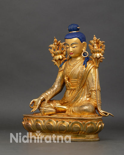 Left profile of Jigme Lingpa statue, hand-engraved robes and lotus pedestal