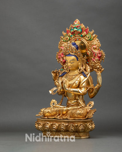 Left profile of Chenrezig statue, handcrafted copper and gold with anjali mudra and lotus