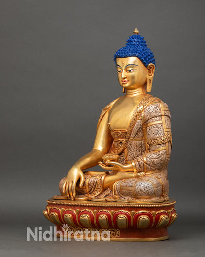 left profile of shakya buddha, meditation pose with gold fire-gilding on copper