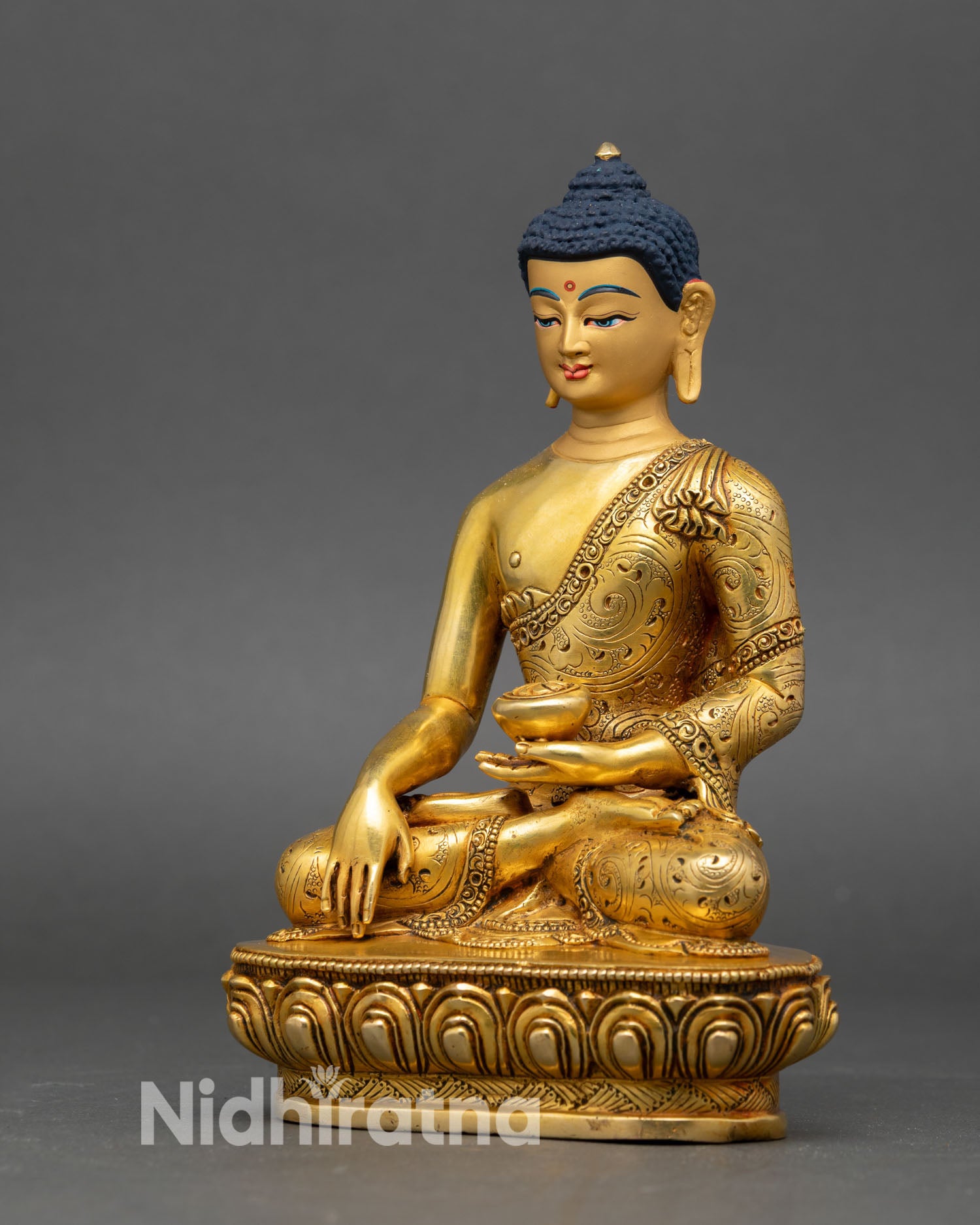 left profile of shakyamuni buddha statue, hand-engraved copper and gold finish